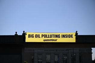 Greenpeace activists paint Geneva streets black to call out Big Oil’s chokehold on Global Plastic Treaty talks
