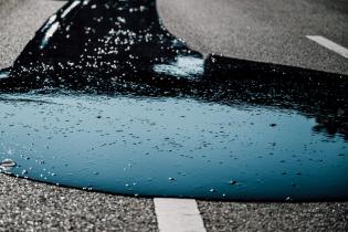 Greenpeace activists paint Geneva streets black to call out Big Oil’s chokehold on Global Plastic Treaty talks