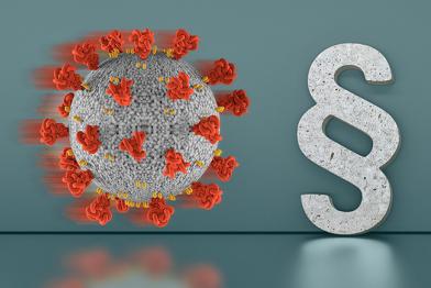 Corona-Virus neben Paragraphenzeichen