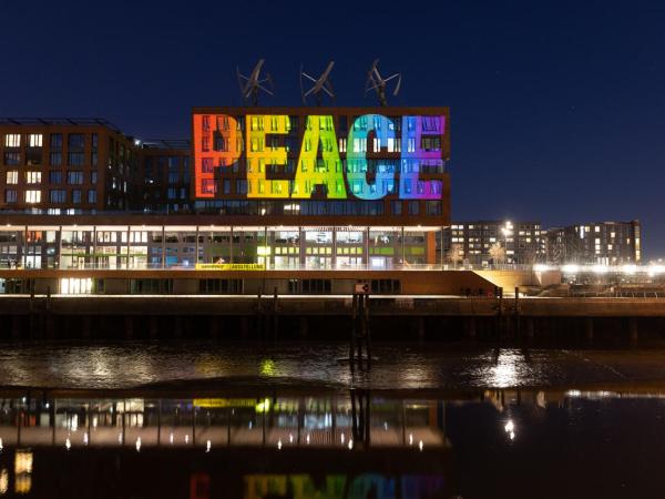 Peace Projection on Headquarter of Greenpeace Germany in Hamburg