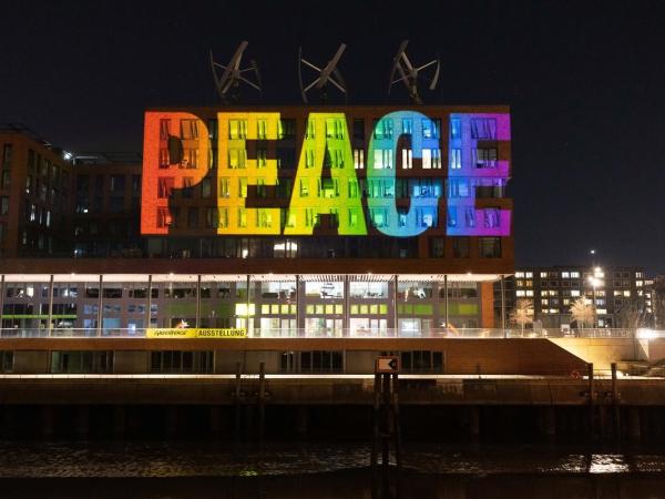 Peace Projection on Headquarter Greenpeace Germany in Hamburg