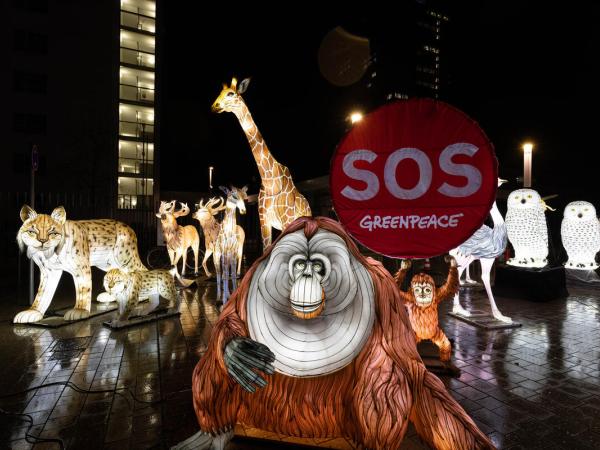 Protest with Luminous Animal Figures for Protecting Nature in front of UN Building in Bonn